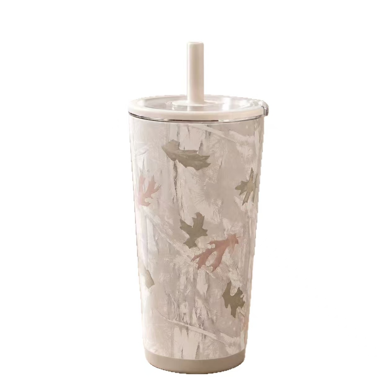 Light-toned autumn leaf tumbler with a cream lid and straw